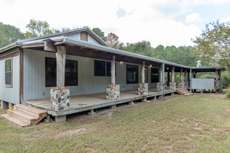 23405 Martha Williams Road Montgomery, TX 77356 - Photo 3 of 45 a view of a house with backyard sitting area and garden