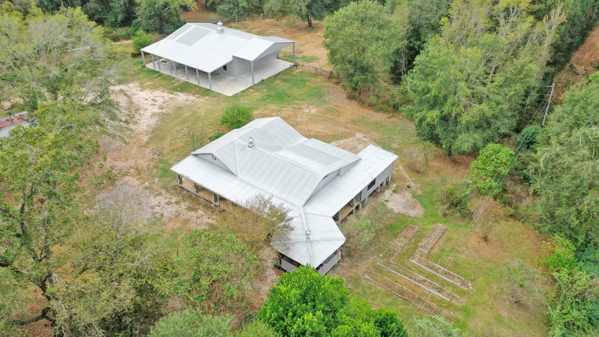 23405 Martha Williams Road Montgomery, TX 77356 - Photo 4 of 45 a picture of a house in a yard with large trees