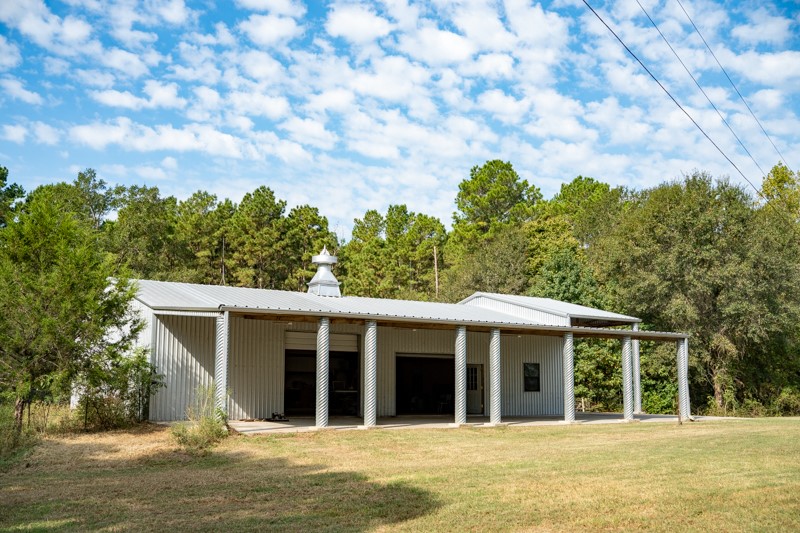 23405 Martha Williams Road Montgomery, TX 77356 - Photo 6 of 45 a view of a house with a backyard