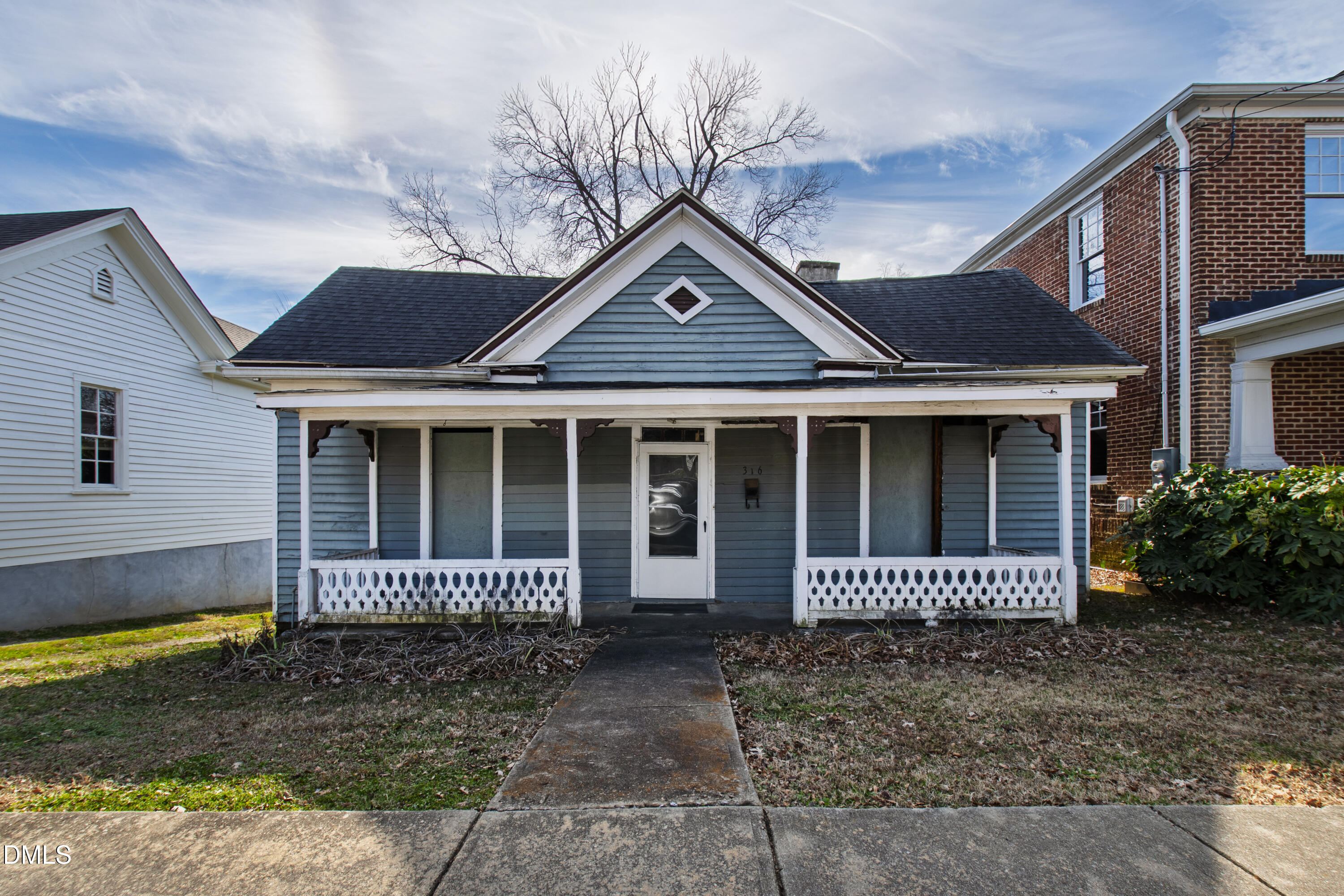 316 East Cabarrus Street Raleigh, NC 27601 - Photo 2 of 20 a front view of a house with a garden