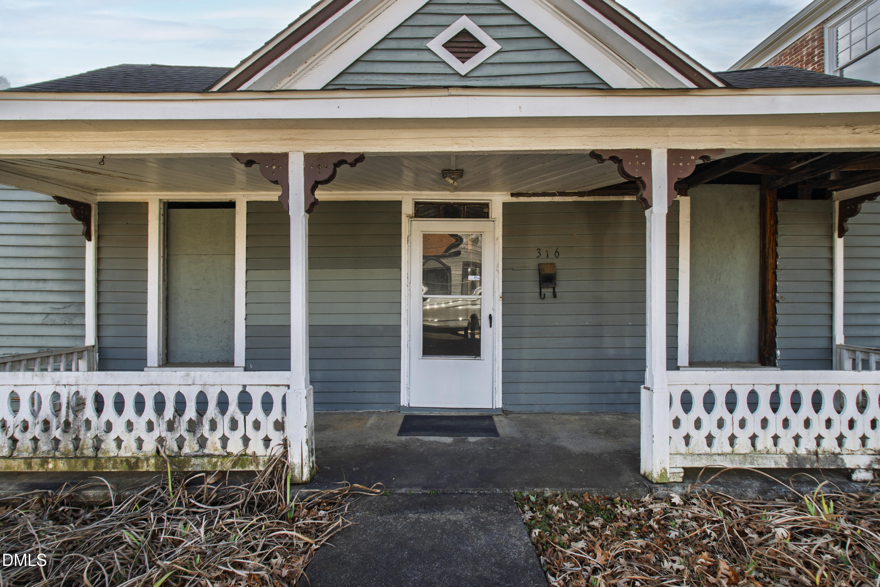 316 East Cabarrus Street Raleigh, NC 27601 - Photo 4 of 20 front view of a house with a bench