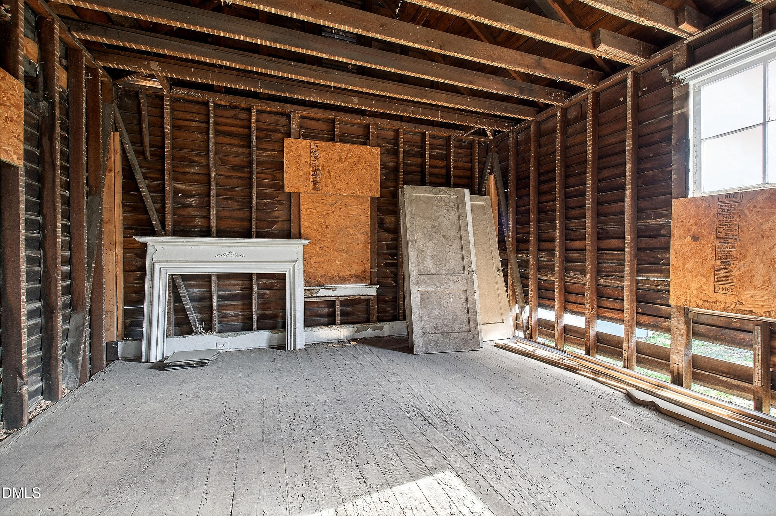 316 East Cabarrus Street Raleigh, NC 27601 - Photo 9 of 20 an empty room with wooden floor and fireplace