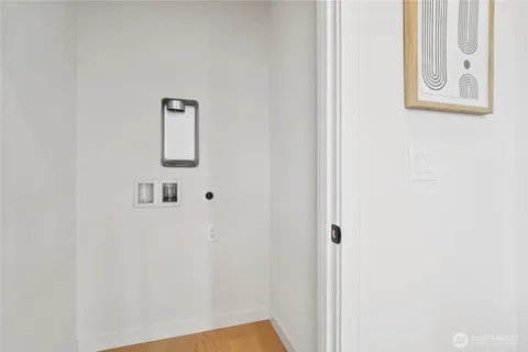 a view of a hallway with paintings on the wall