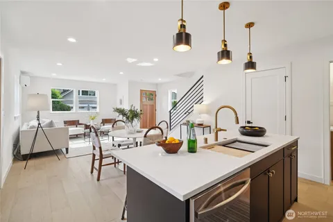 a kitchen with a sink a counter and appliances