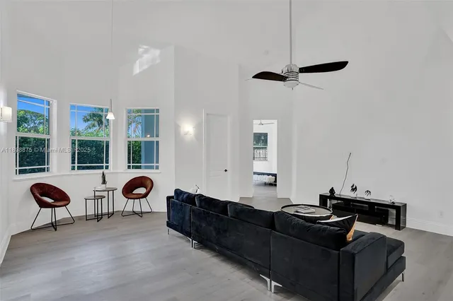 a bedroom with furniture and windows