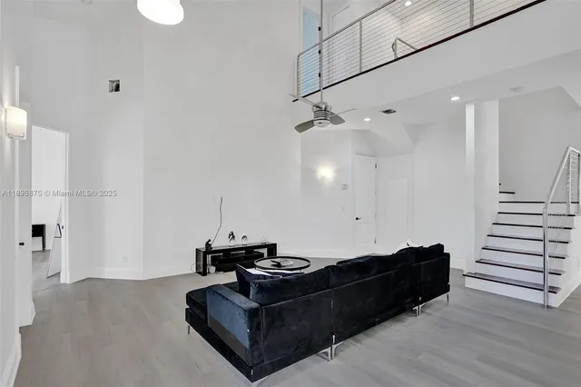 a bedroom with a bed and a wall painting