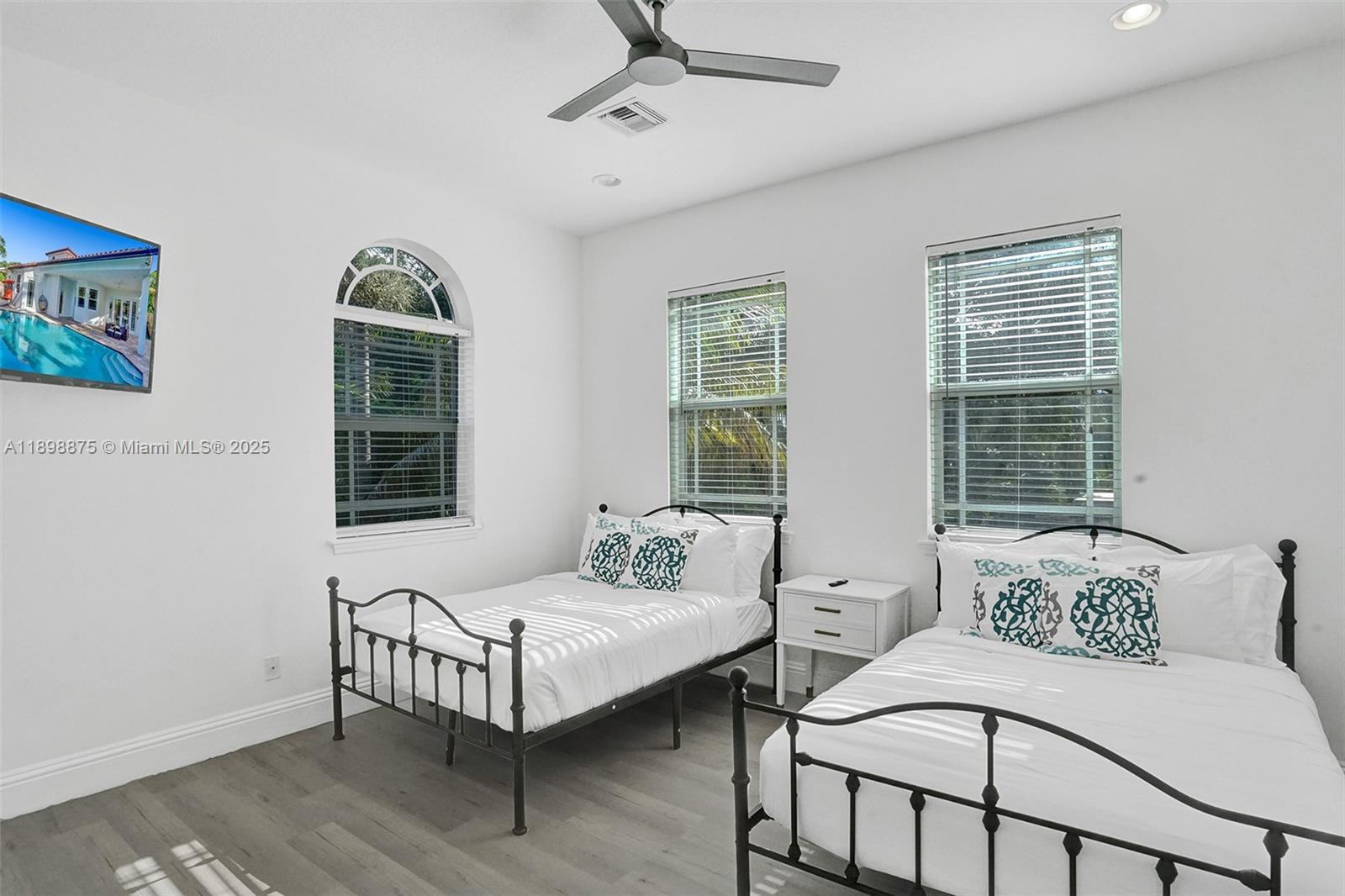 1207 Southwest 21st Street Fort Lauderdale, FL 33315 - Photo 20 of 81 a spacious bedroom with two beds and a window