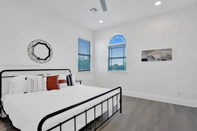 a bedroom with a bed and window