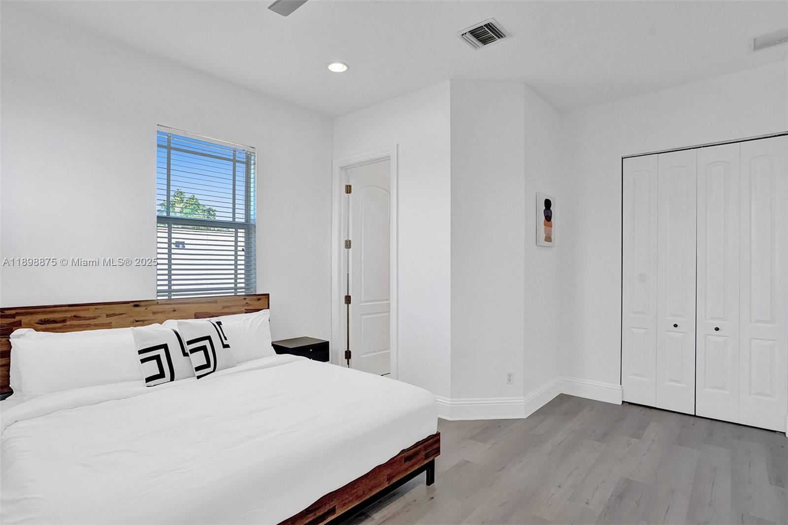 1207 Southwest 21st Street Fort Lauderdale, FL 33315 - Photo 33 of 81 a bedroom with a bed and a window