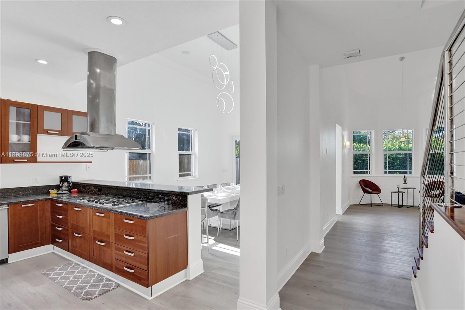 1207 Southwest 21st Street Fort Lauderdale, FL 33315 - Photo 4 of 81 a kitchen with stainless steel appliances granite countertop a stove a sink and a refrigerator
