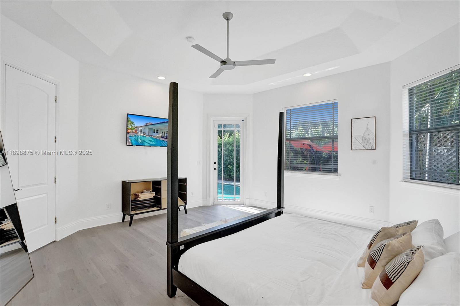 1207 Southwest 21st Street Fort Lauderdale, FL 33315 - Photo 42 of 81 a bedroom with a bed and a view of kitchen