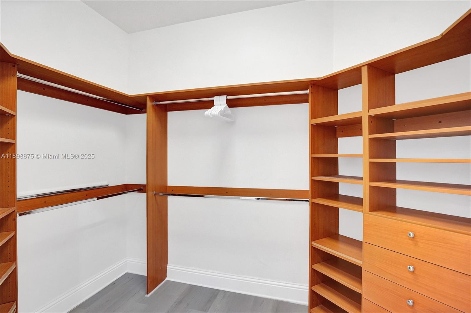 1207 Southwest 21st Street Fort Lauderdale, FL 33315 - Photo 44 of 81 a view of walk in closet with empty racks