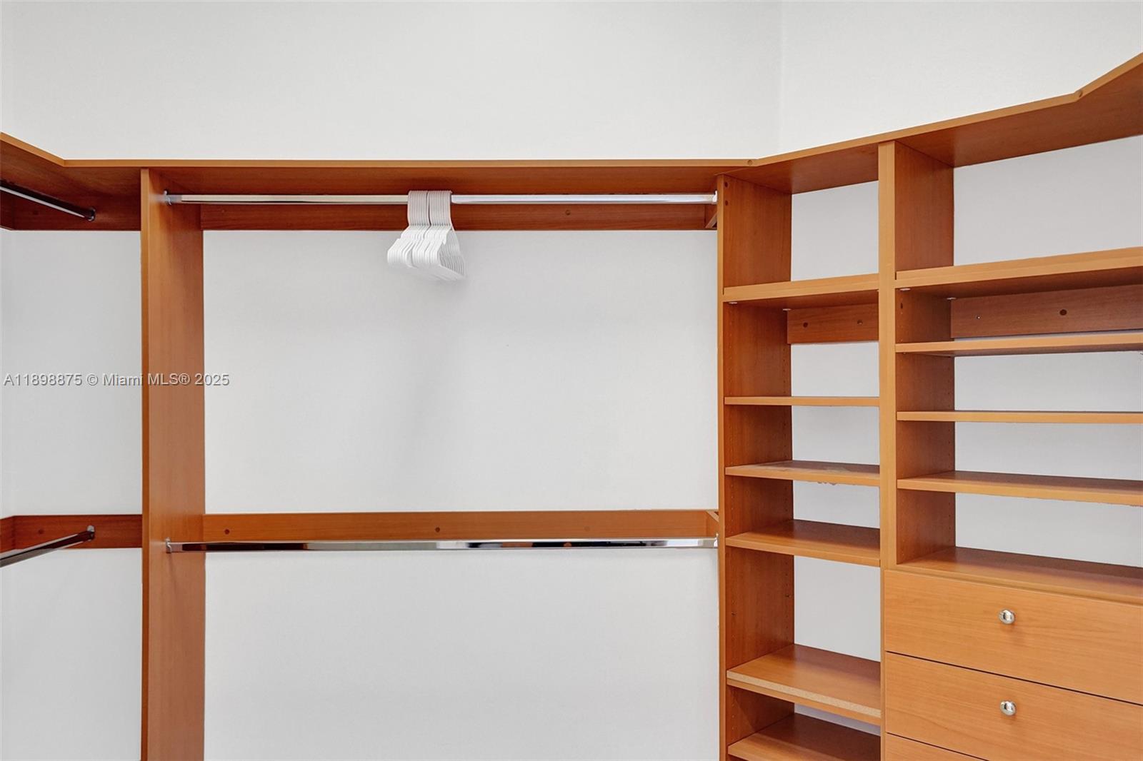 1207 Southwest 21st Street Fort Lauderdale, FL 33315 - Photo 45 of 81 a view of walk in closet with empty racks