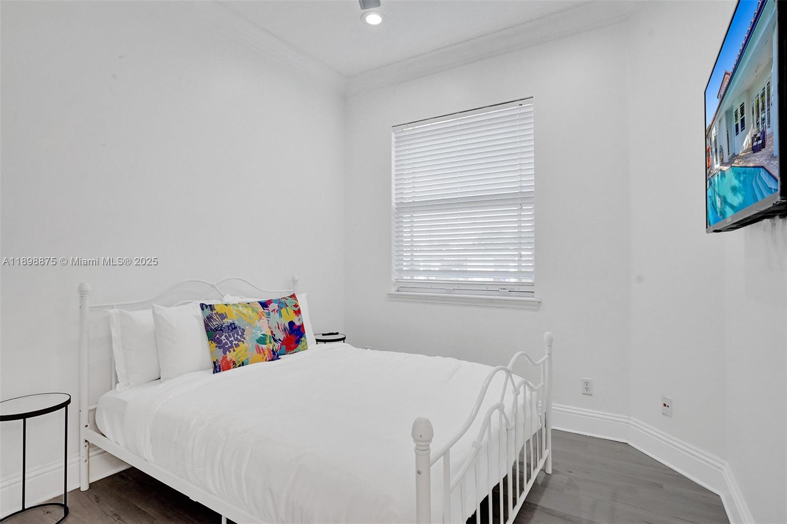 1207 Southwest 21st Street Fort Lauderdale, FL 33315 - Photo 49 of 81 a bedroom with a bed and window