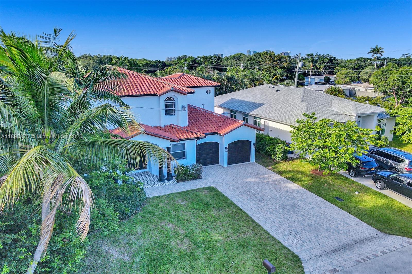 1207 Southwest 21st Street Fort Lauderdale, FL 33315 - Photo 77 of 81 a front view of a house with a yard