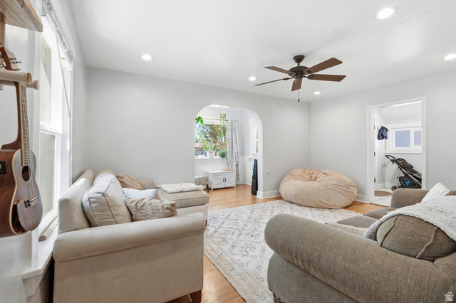 210 North 200 West Logan, UT 84321 - Photo 5 of 31 Living area featuring hardwood flooring, recessed lighting, a ceiling fan, a window, and an arched doorway