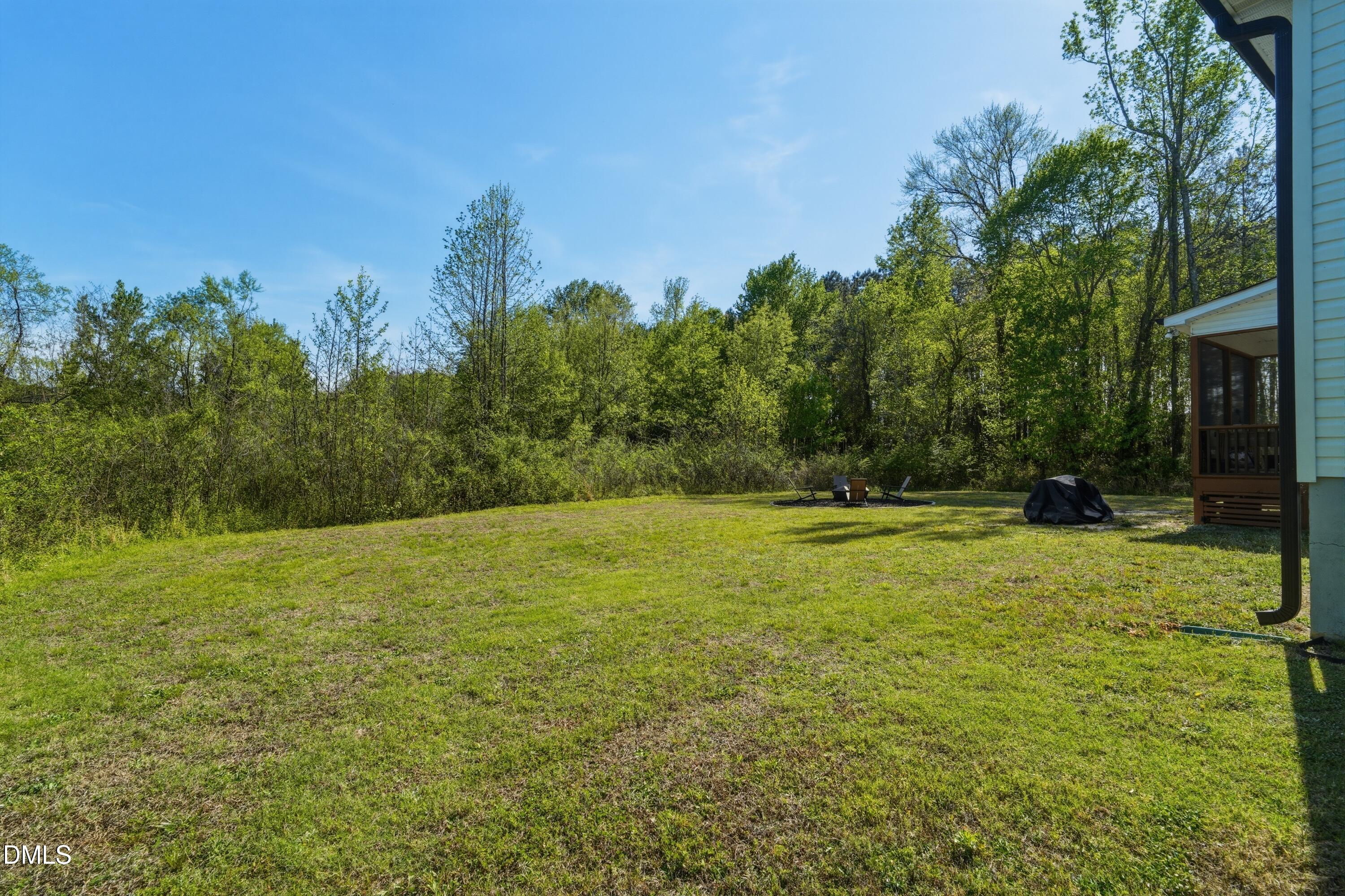 386 Howards Crossing Drive Wendell, NC 27591 - Photo 25 of 31 a view of outdoor space with deck and yard