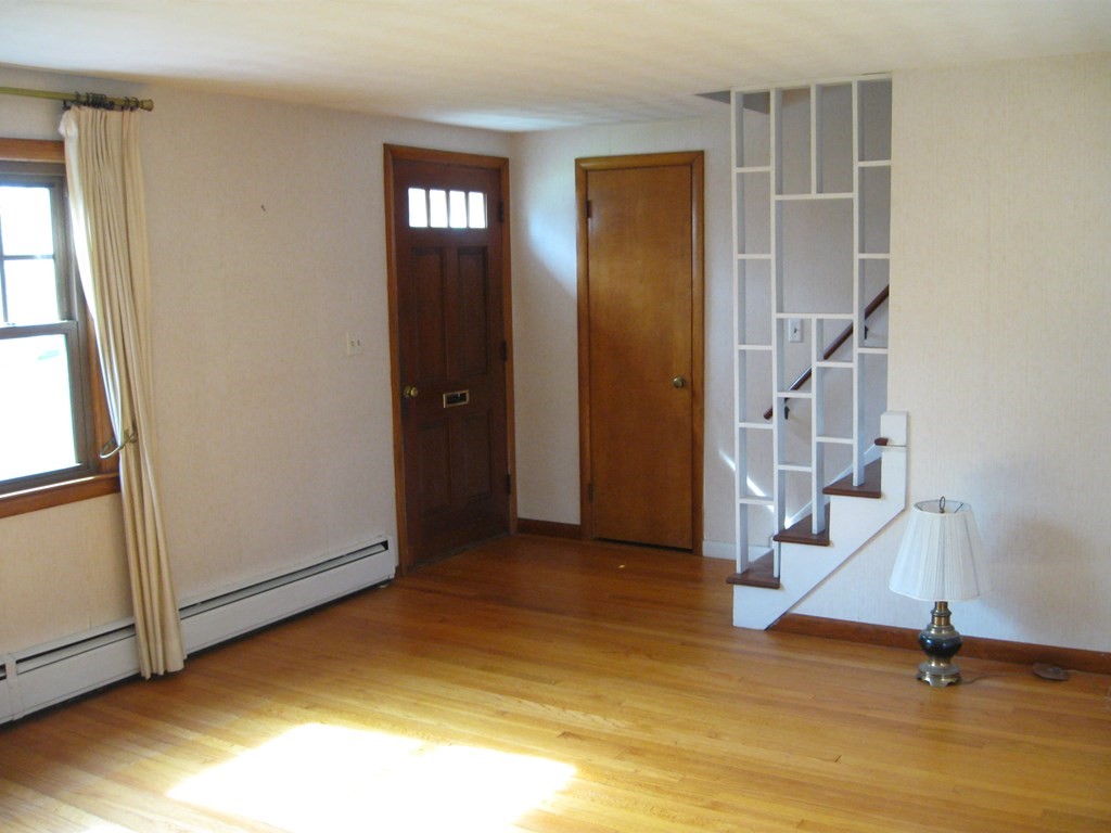 269 West Allen Ridge Road Springfield, MA 01118 - Photo 11 of 25 a view of empty room with wooden floor and fan