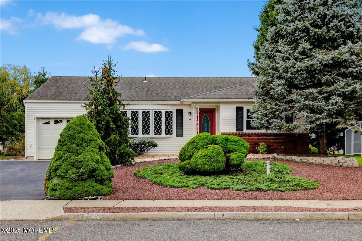 front view of a house with a garden