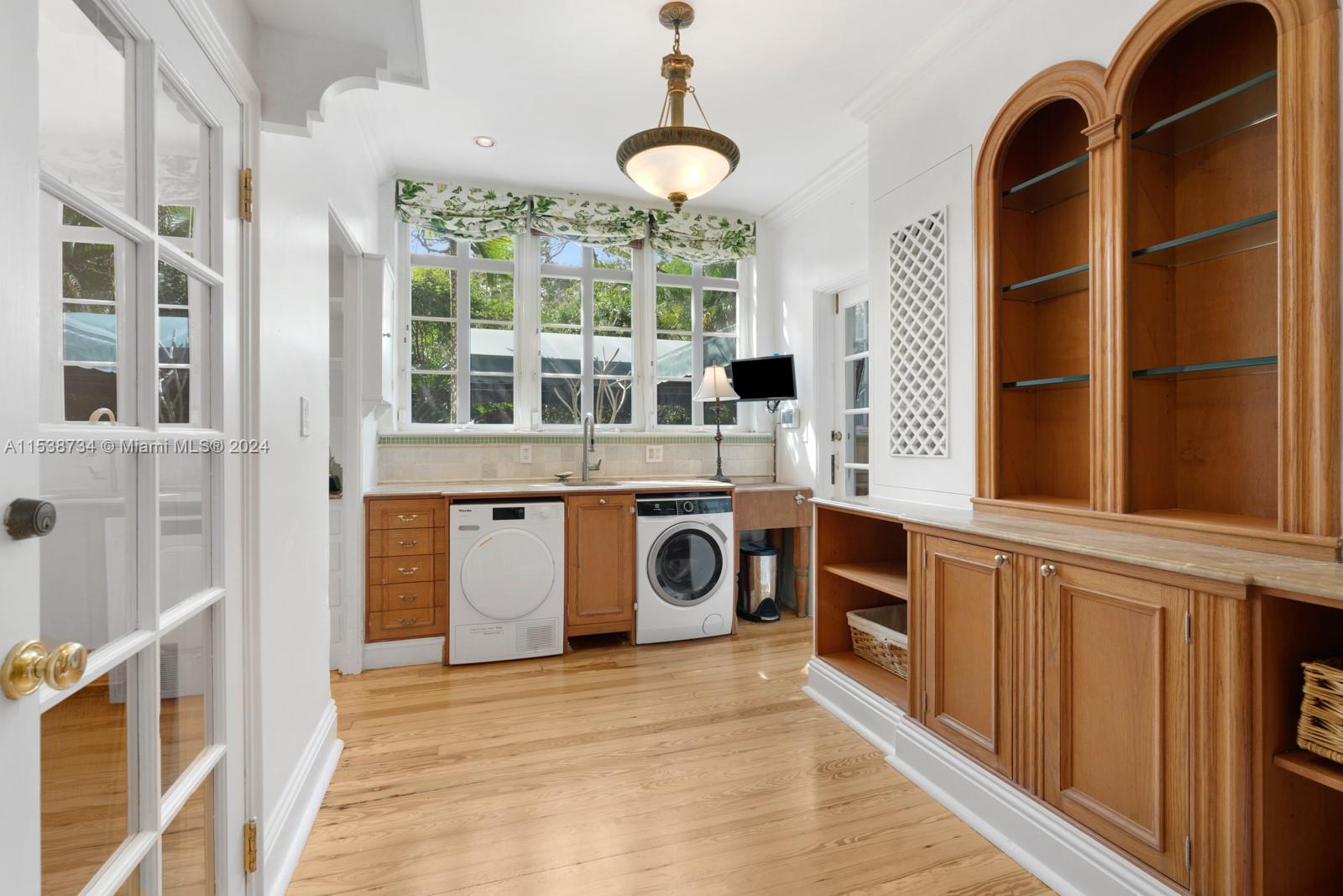 3685 Royal Palm Avenue Miami, FL 33133 - Photo 11 of 41 a kitchen with stainless steel appliances granite countertop a stove and a sink