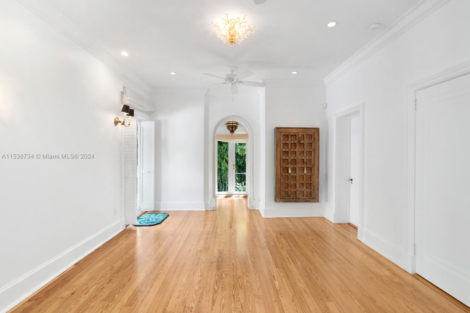 3685 Royal Palm Avenue Miami, FL 33133 - Photo 15 of 41 a view of an empty room with wooden floor and a window