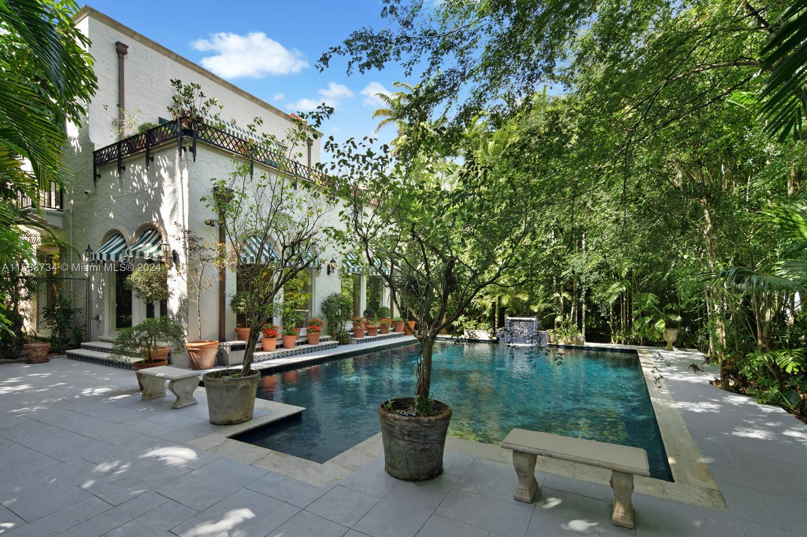 3685 Royal Palm Avenue Miami, FL 33133 - Photo 26 of 41 a view of a swimming pool with a patio