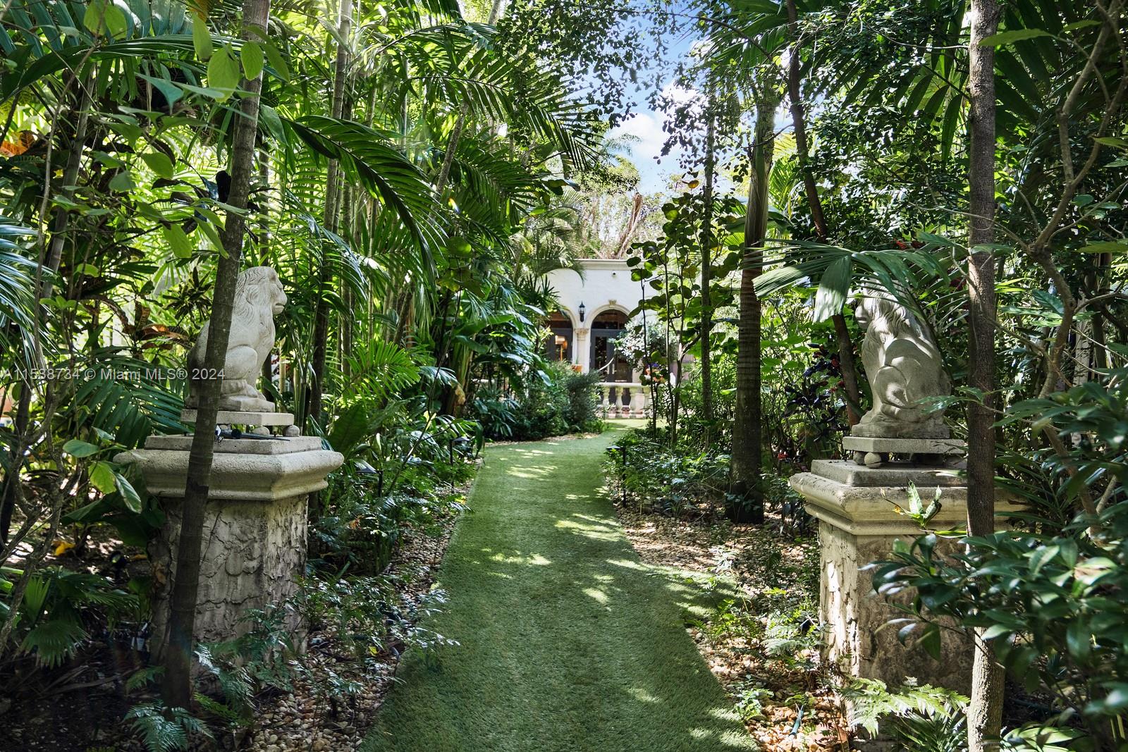 3685 Royal Palm Avenue Miami, FL 33133 - Photo 27 of 41 a view of a garden with plants and large trees