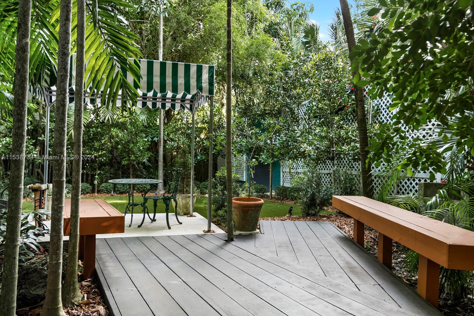 3685 Royal Palm Avenue Miami, FL 33133 - Photo 30 of 41 a view of balcony with wooden floor and outdoor seating