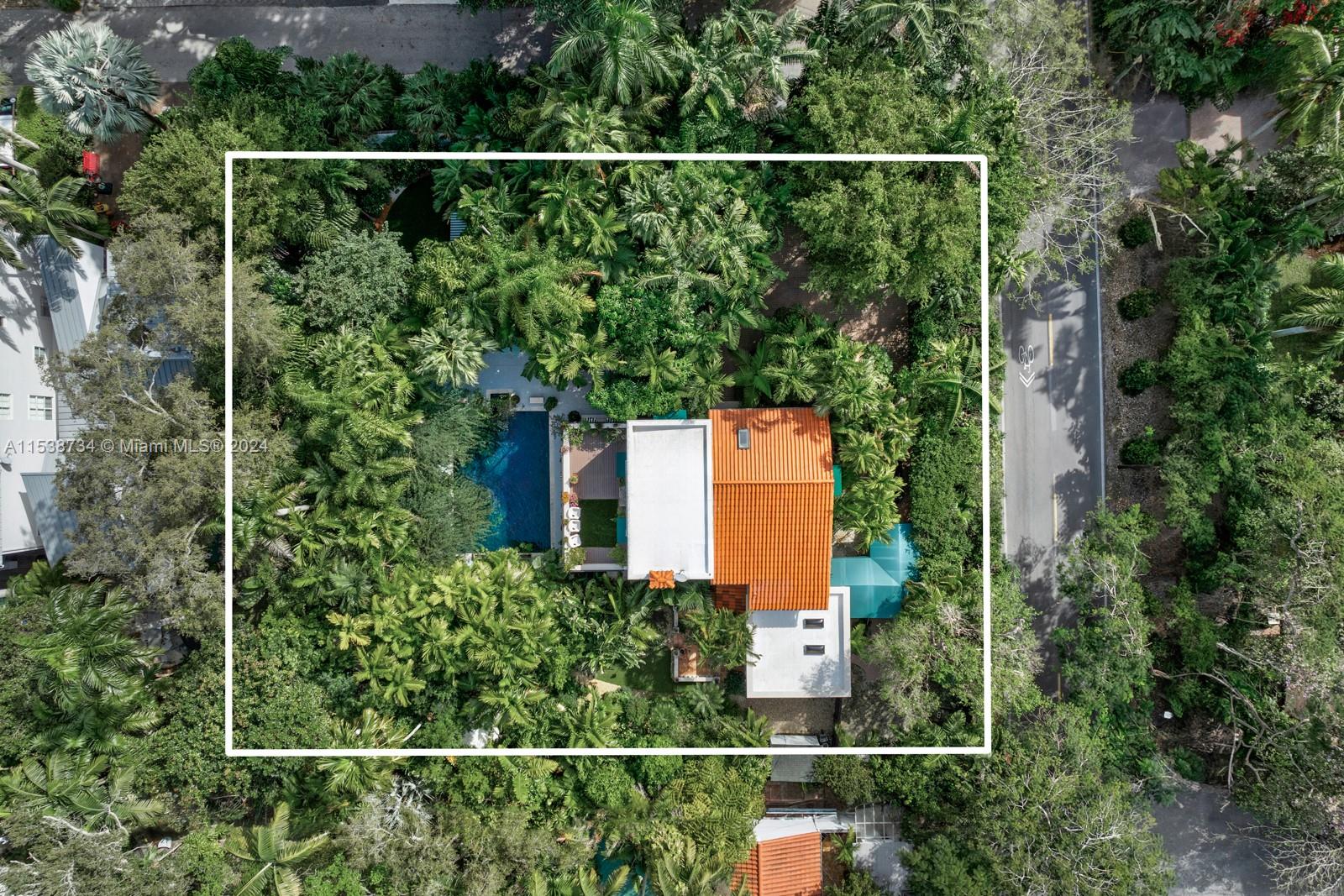 3685 Royal Palm Avenue Miami, FL 33133 - Photo 38 of 41 an aerial view of a house and trees all around