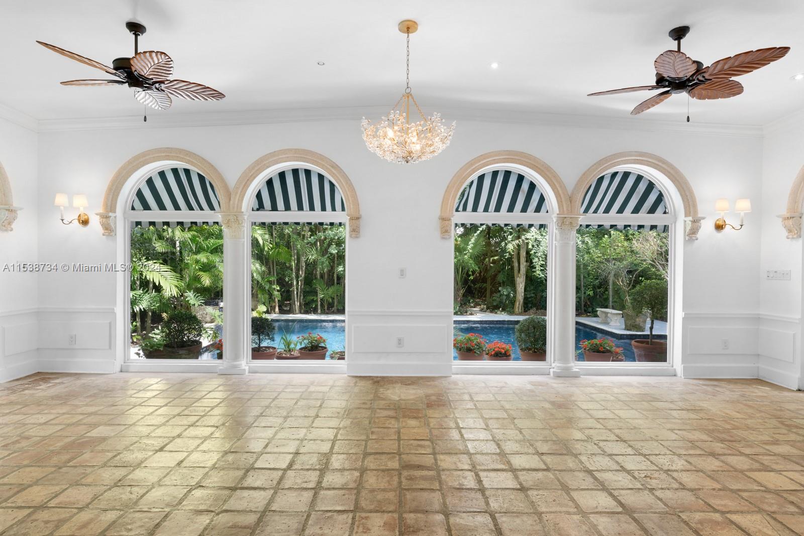 3685 Royal Palm Avenue Miami, FL 33133 - Photo 5 of 41 a view of an entryway with a chandelier