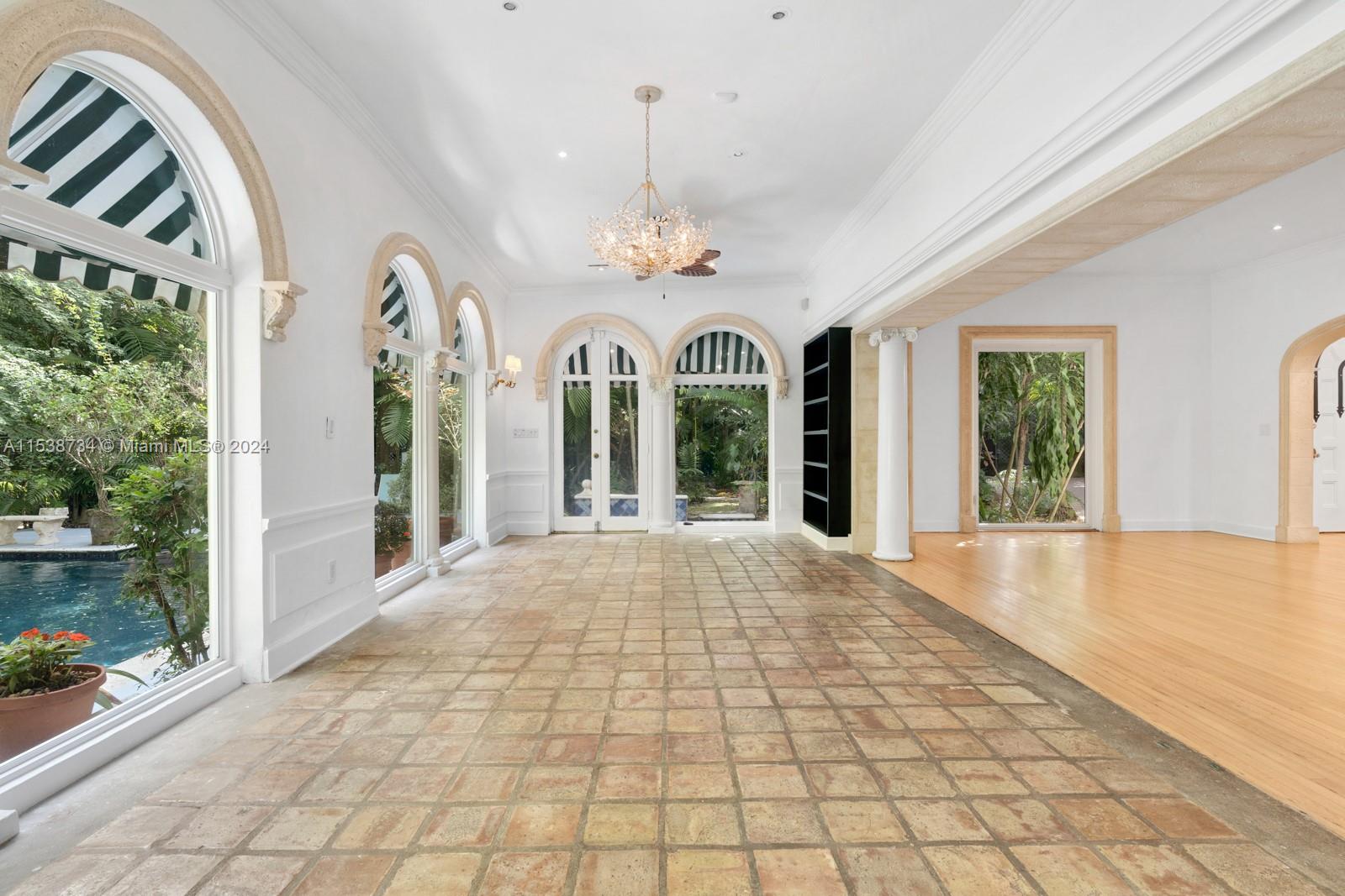 3685 Royal Palm Avenue Miami, FL 33133 - Photo 6 of 41 a view of an entryway with a chandelier
