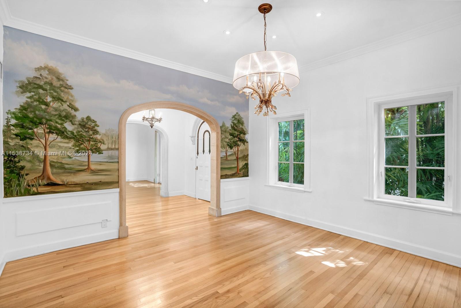 3685 Royal Palm Avenue Miami, FL 33133 - Photo 9 of 41 a view of an empty room with wooden floor and a window
