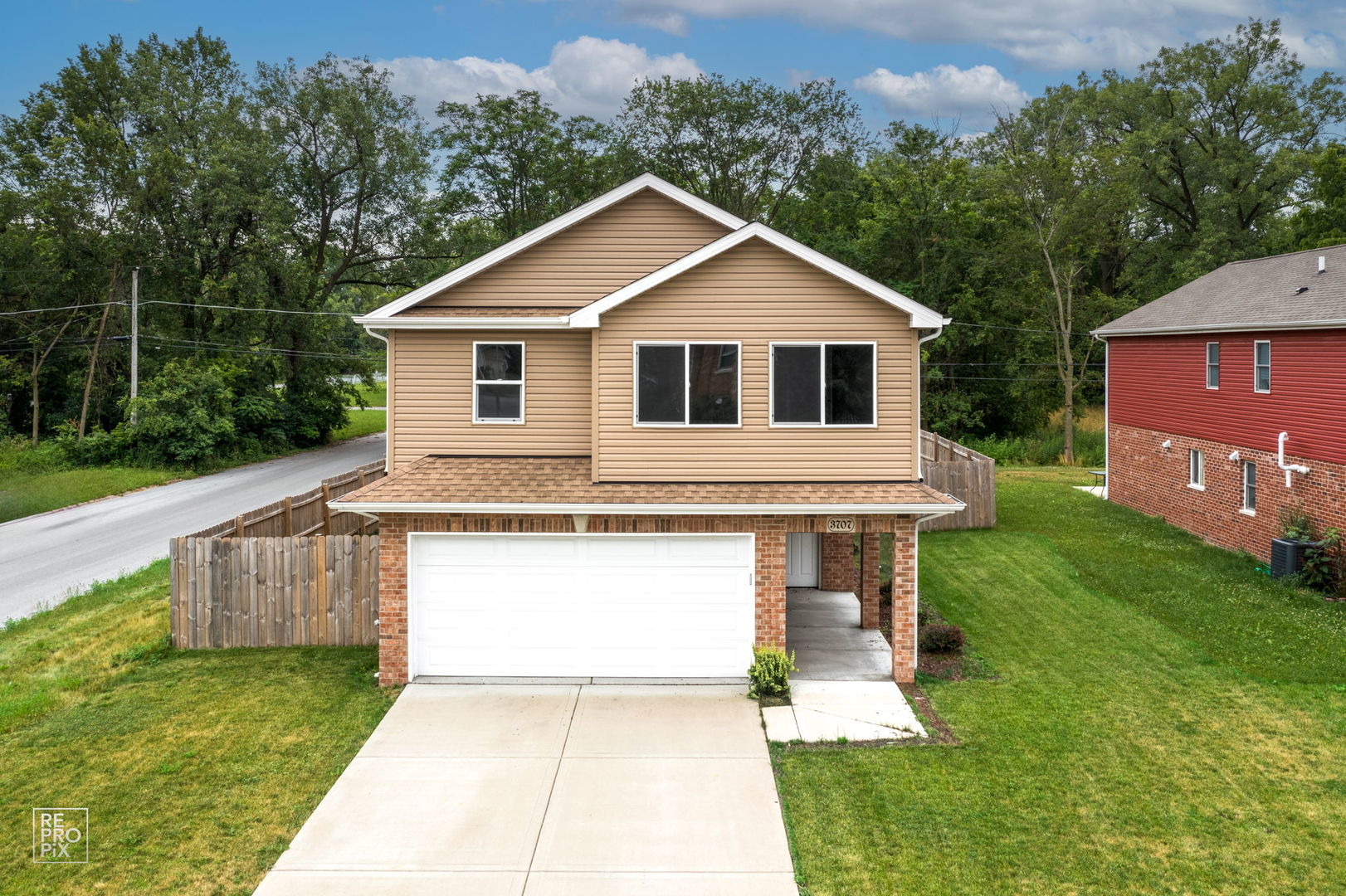 3707 139th Place Robbins, IL 60472 - Photo 1 of 27 a front view of house with yard and green space