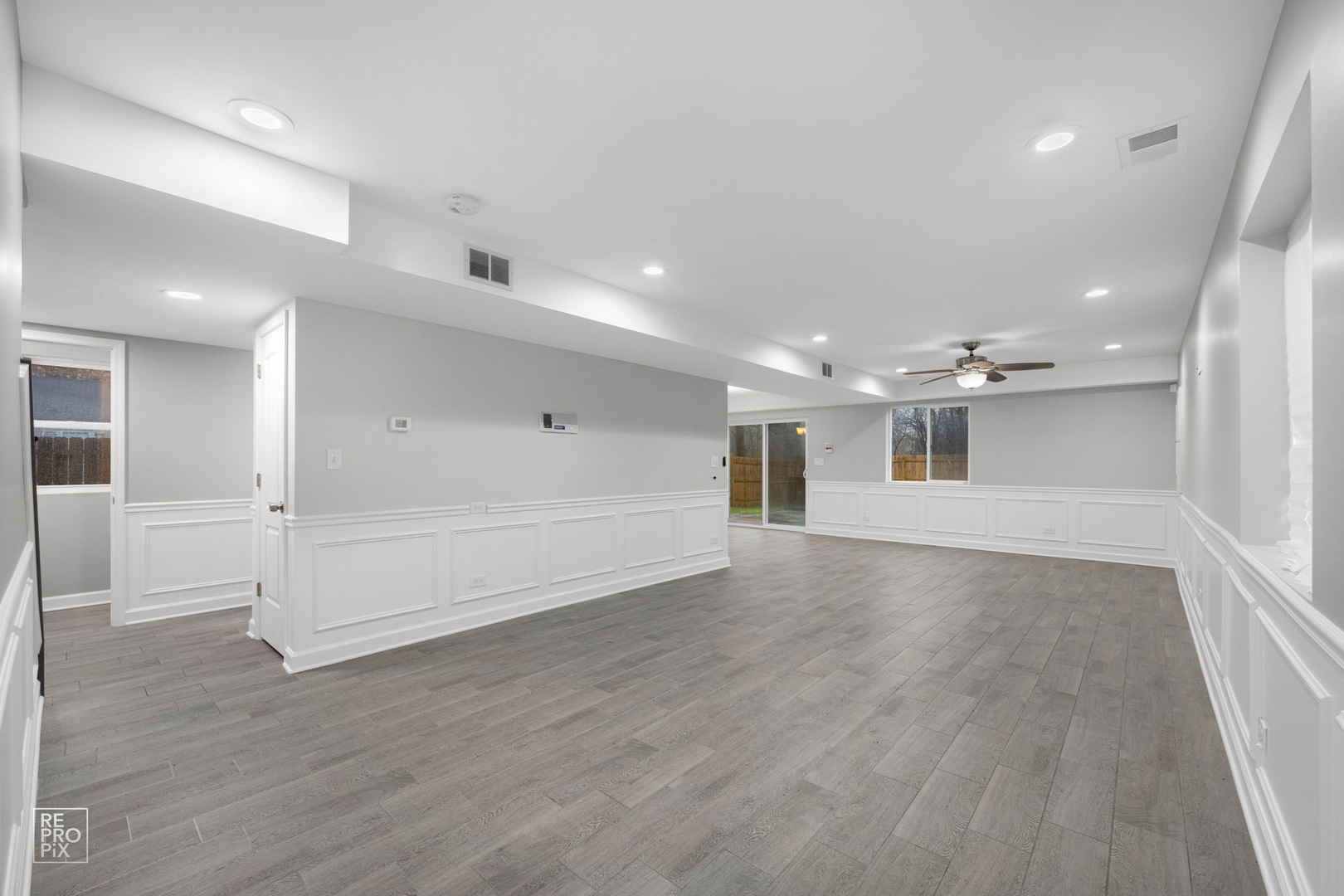 3707 139th Place Robbins, IL 60472 - Photo 5 of 27 an empty room with wooden floor and windows