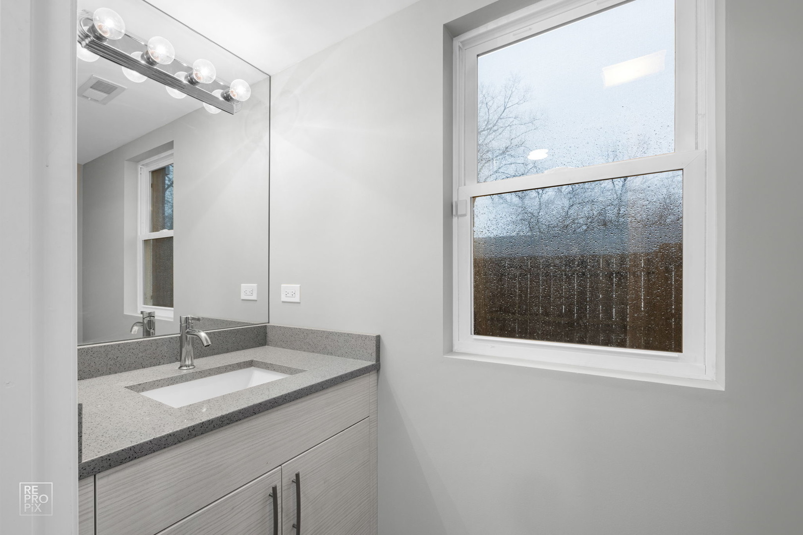 3707 139th Place Robbins, IL 60472 - Photo 6 of 27 a bathroom with a sink a vanity and a mirror