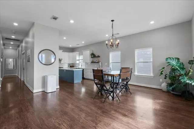 an open kitchen with a table and chairs