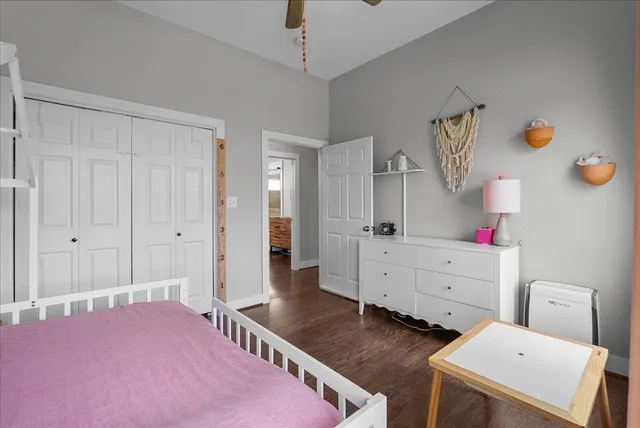 a bedroom with a bed and a dresser