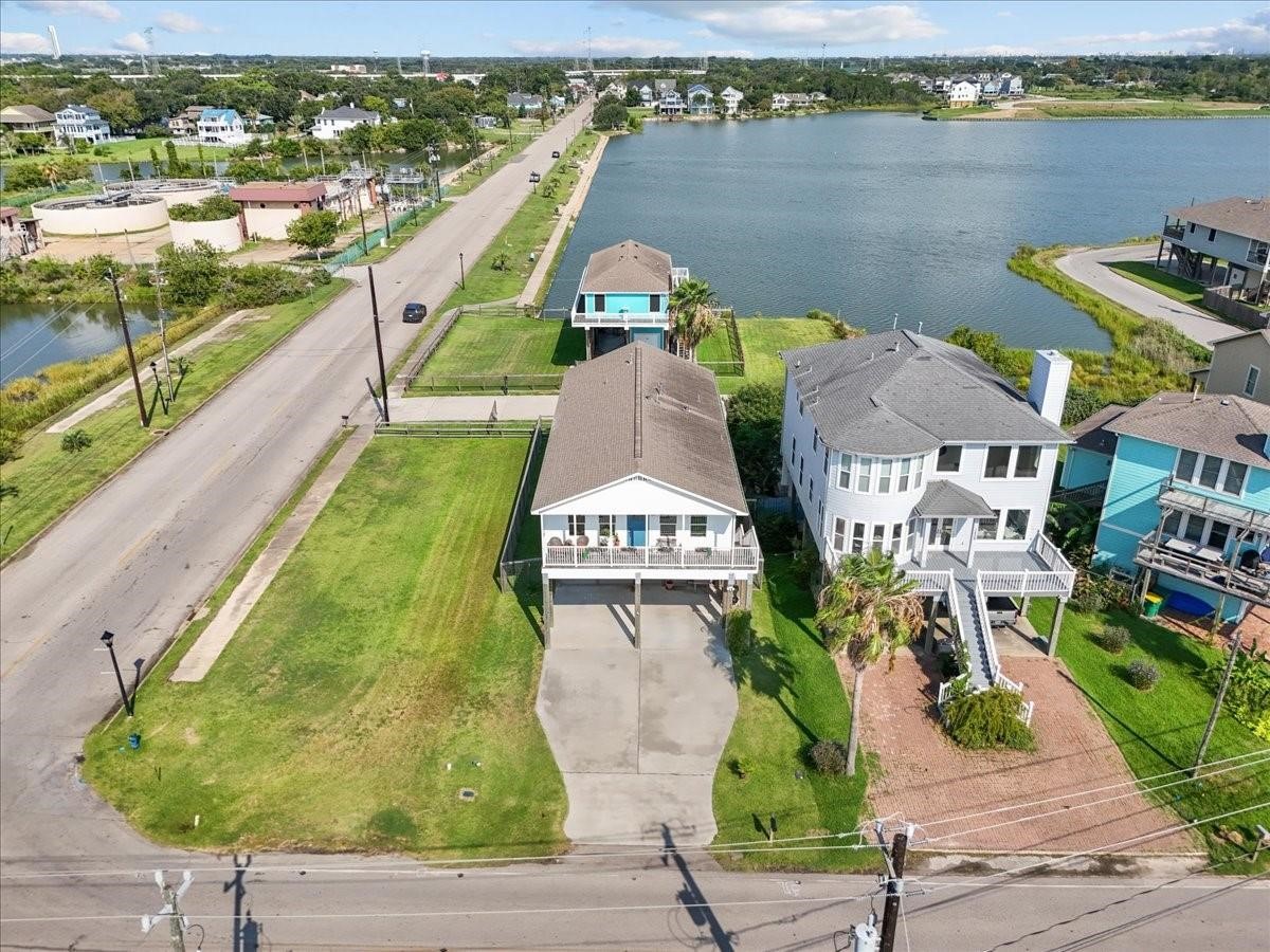 1205 Todville Road Seabrook, TX 77586 - Photo 4 of 37 an aerial view of a house with a garden and lake view