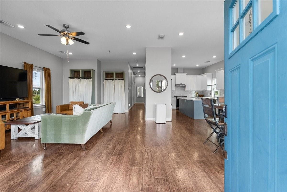 1205 Todville Road Seabrook, TX 77586 - Photo 7 of 37 a living room with furniture and a flat screen tv