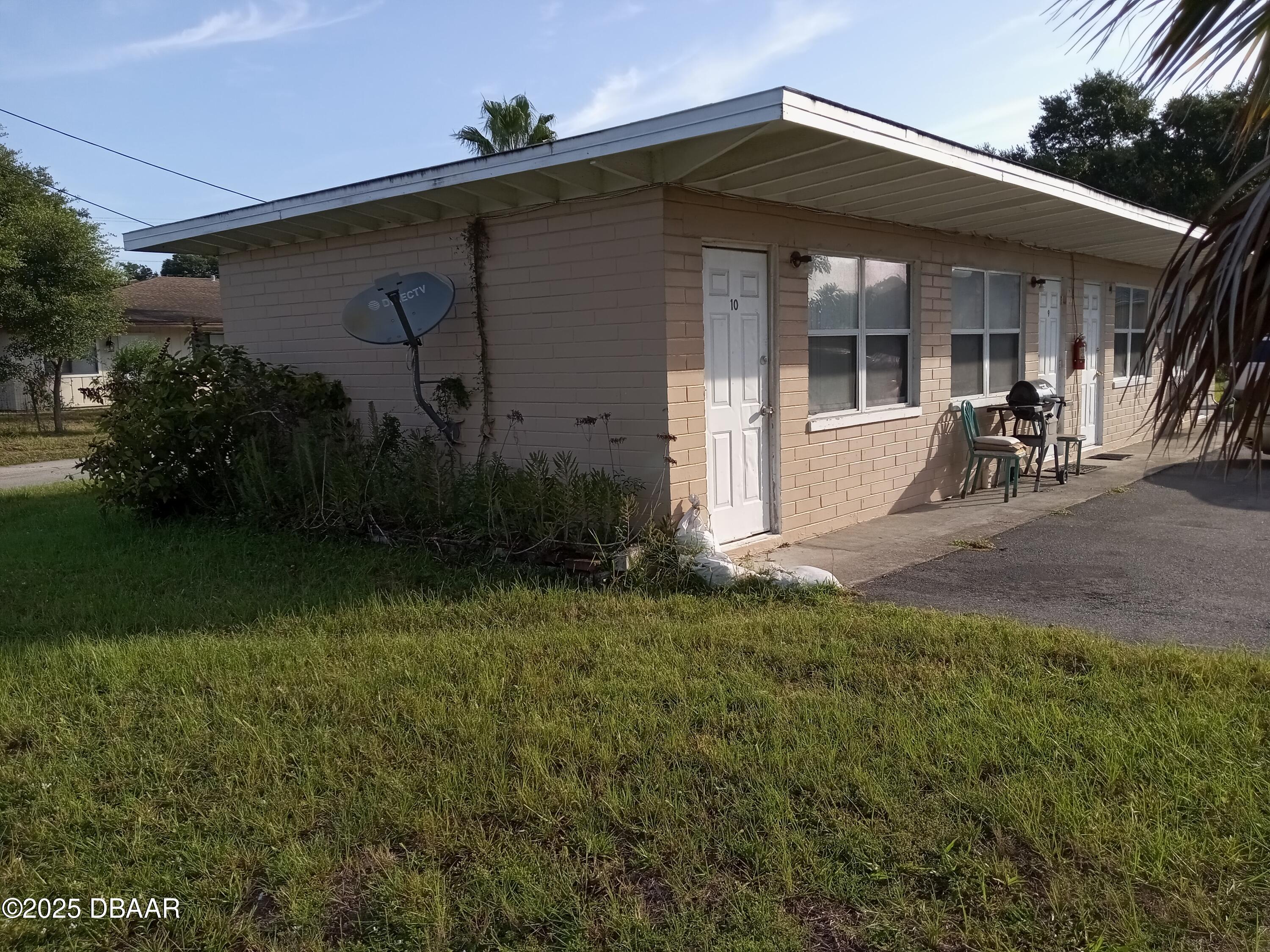 703 South Ridgewood Avenue, Unit 10 Edgewater, FL 32132 - Photo 2 of 5 a view of a front view of a house