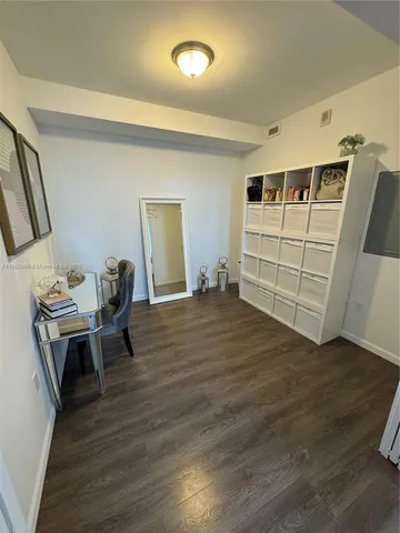 a view of a livingroom with furniture and wooden floor