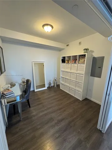 a view of a livingroom with furniture and wooden floor