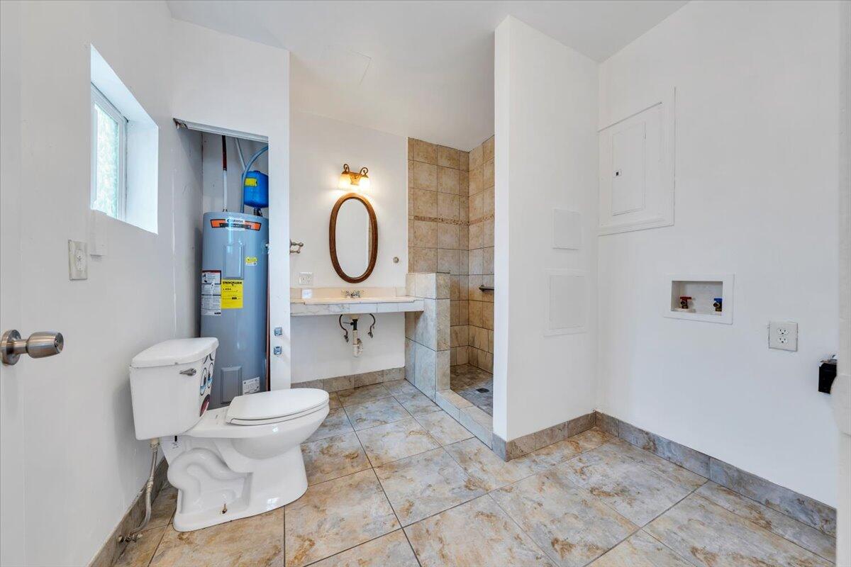 1013 Jamison Avenue Southeast Roanoke, VA 24013 - Photo 18 of 20 a living room with furniture a rug and a window