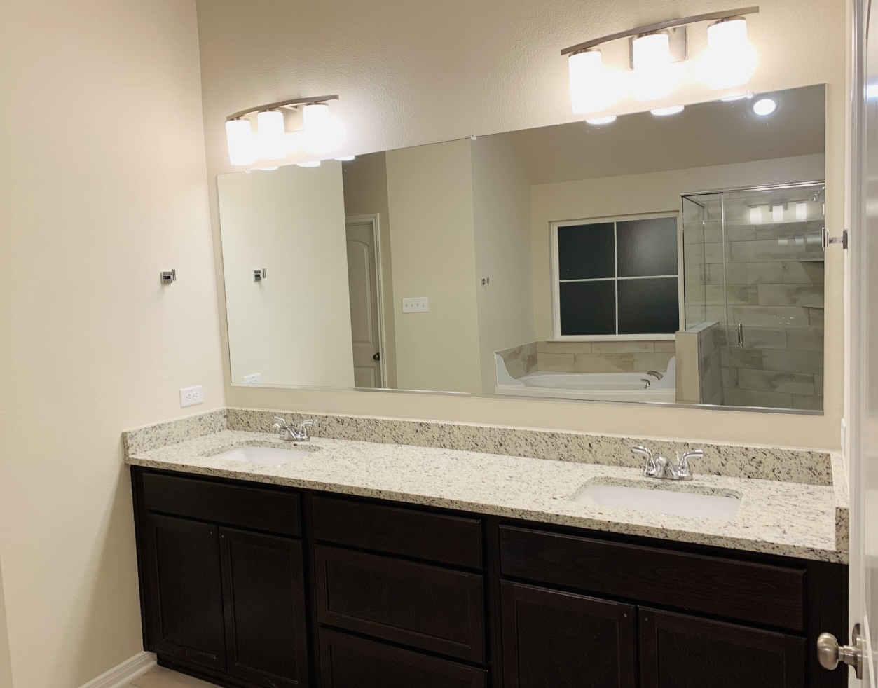 808 Fallbrook Drive Temple, TX 76502 - Photo 9 of 36 Full bath with double vanity, a bath, and a tile shower