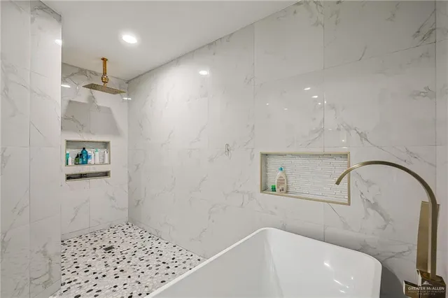 a bathroom with a sink a toilet and a bathtub