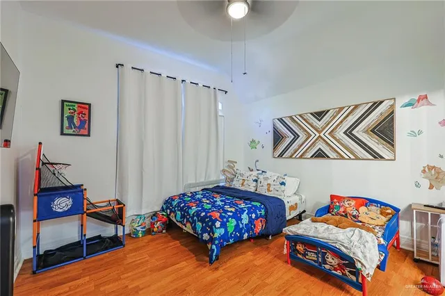 a bathroom with a sink vanity mirror and toilet