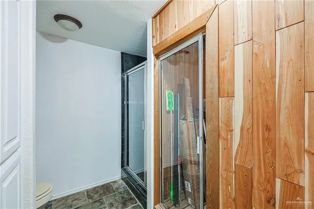 a view of a house with swimming pool and sitting area