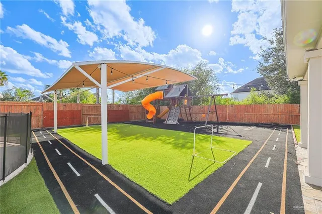 a view of a backyard with a large tree