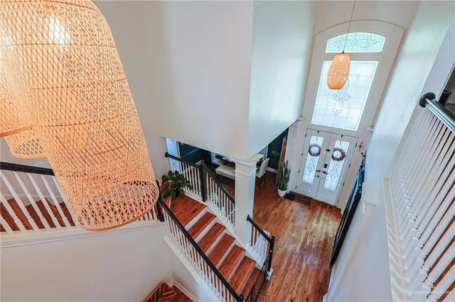 a view of an entryway with wooden floor