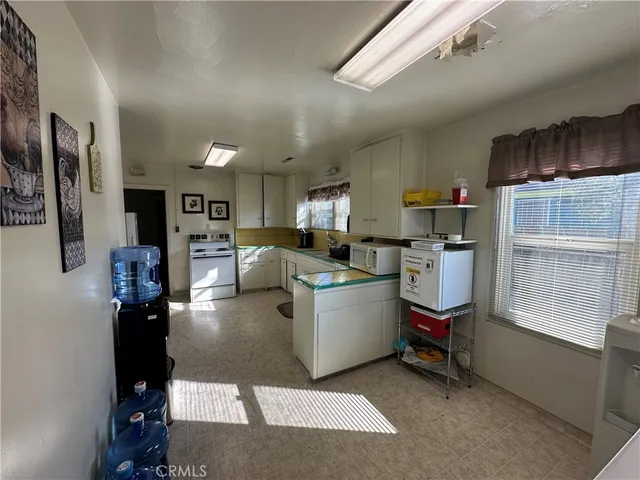 a living room with lots of furniture and appliances